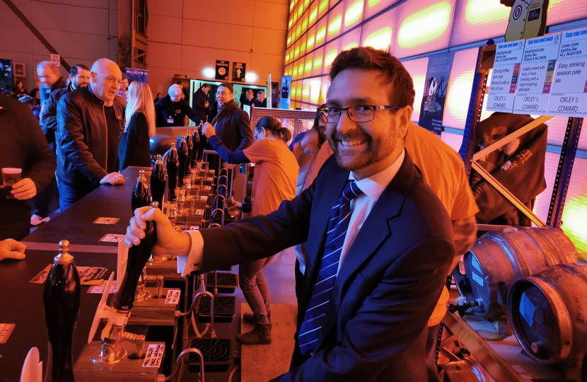 Alexander Stafford MP pulls a pint at Rotherham Real Ale Festival