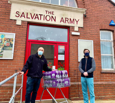 Alexander distributes Ribena with Postmaster Andy Bhullar