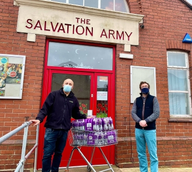 Alexander distributes Ribena with Postmaster Andy Bhullar