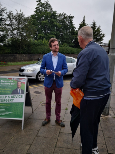 Alexander Stafford MP speaking to resident in Swallownest