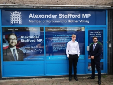 Alexander Stafford MP outside his constituency office with student Rowen