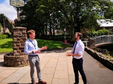 Alexander Stafford MP speaks to Cllr David Fisher in Whiston